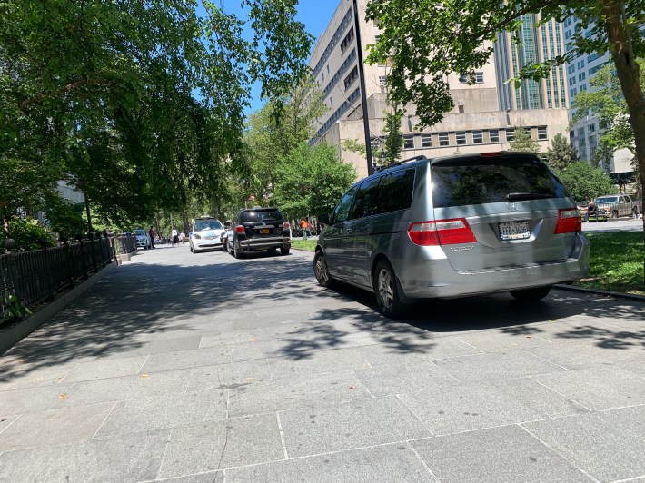 Two cars parked in Cadman Plaza before Adams' bike ride. Photo: Gersh Kuntzman