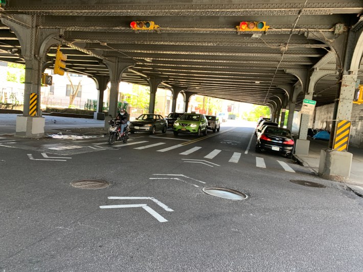 The most dangerous part of 39th Avenue — the LIRR trestle — is not covered by the DOT's plan. Removing just 10 parking spaces would make cyclists and drivers immeasurably safer through this narrow sluice. Photo: Gersh Kuntzman