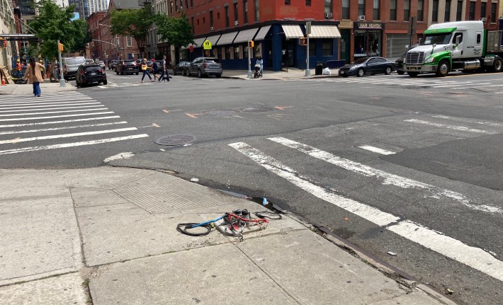 A tangle of wires is all that remains of what neighbors said was a pedestrian-crossing signal that was toppled by a speeding vehicle several months ago. Photo: Henry Beers Shenk