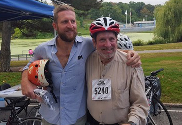 Replogle, posing with then-Transportation Alternatives Executive Director Paul Steely White after a ride.