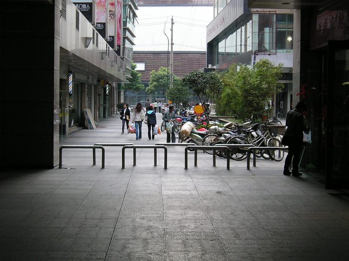 Multiple U-shaped bollards positioned to keep motorcycles and e-bikes out of a pedestrian zone in Changzhou, China. Photo: Michael King