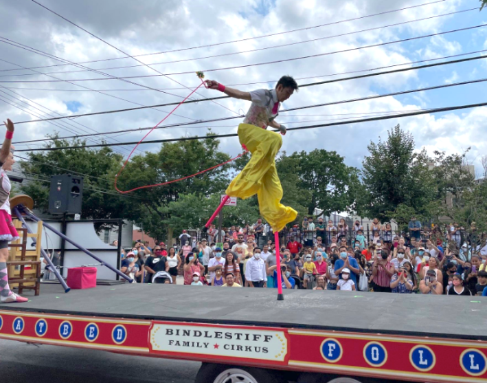 A circus performer walked on stilts.