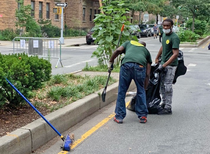 City Cleanup Corps workers have been beautifying the open street in Jackson Heights. Photo: 34th Avenue Open Streets Coalition