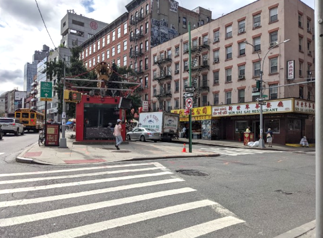 The Gateways to Chinatown sits alone on an island in a sea of cars. Photo: Annie Weinstock
