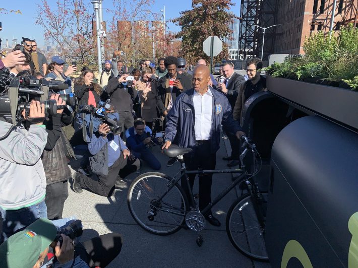 Brooklyn Borough President and future Mayor Eric Adams prepares to load his bike into an Oonee Mini. Photo: Gersh Kuntzman