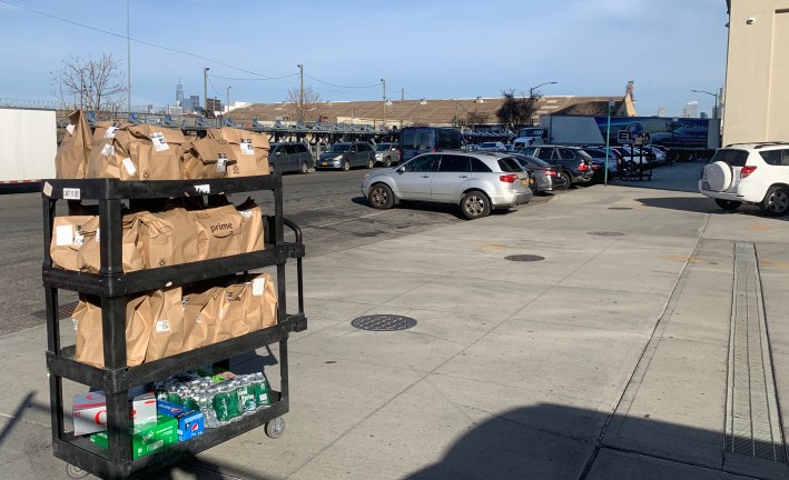 Trucks come in and cars go out all day at the Amazon distribution center in Sunset Park. Photo: Gersh Kuntzman