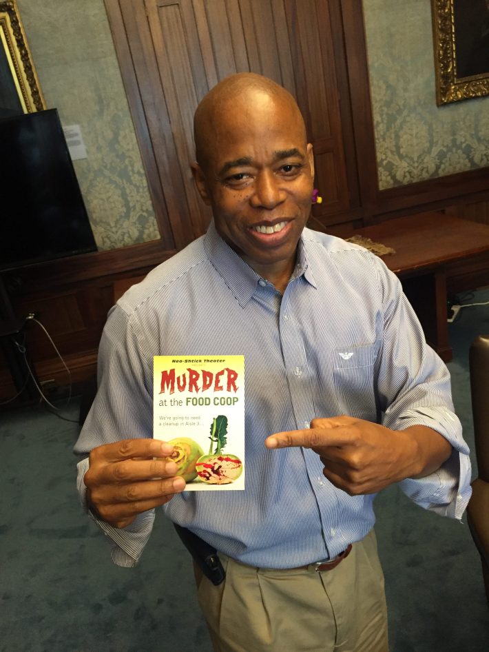 This is not a doctored photo. In 2016, then Brooklyn Borough President Eric Adams endorsed our editor's play, "Murder at the Food Coop."