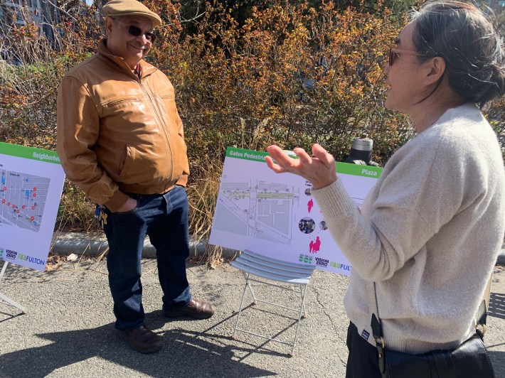 Neighbors talking over the plan.