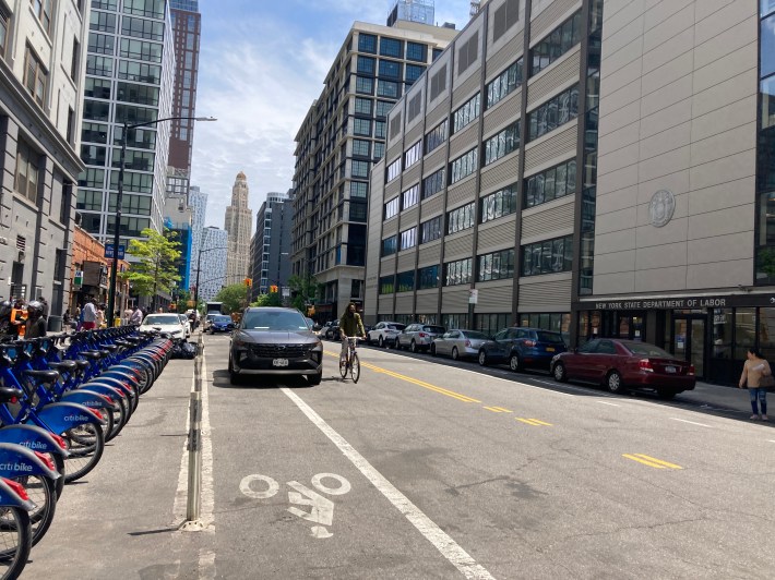 Cars and trucks block the bike lane. Photo: Julianne Cuba