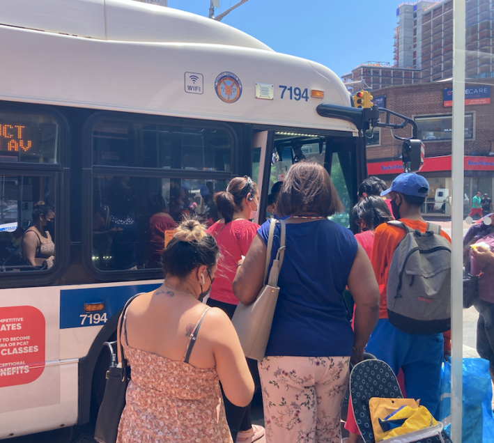 Riders boarding the Q56 after a more than hour-long wait. Photo: Julianne Cuba