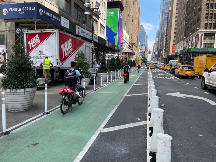 The protected bike lane on 36th Street, in between bollards and a painted sidewalk extension. Photo: Dave Colon