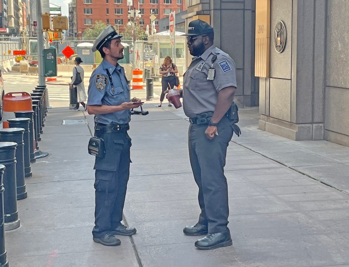 The cop and the federal security guard. Photo: Noah Martz