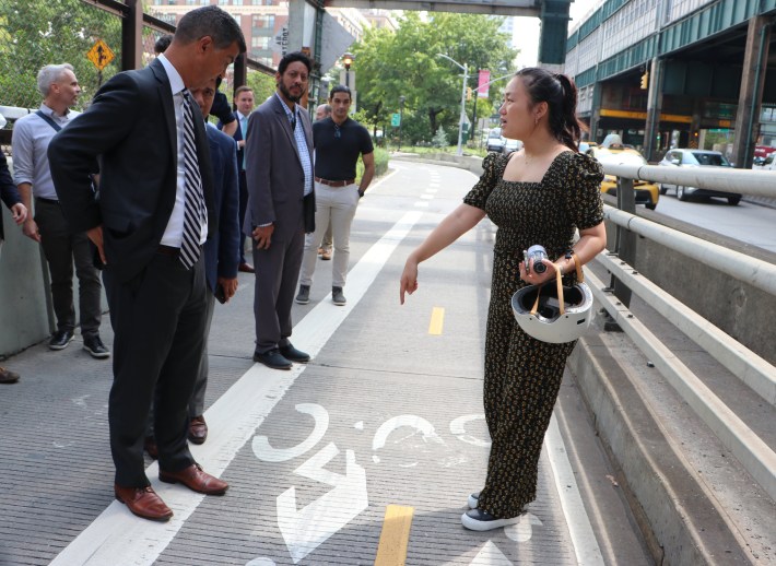 Council Member Julie Won confronts DOT Commissioner Ydanis Rodriguez last year with just how little space is afforded cyclists and pedestrians, who share just one lane for bi-directional travel. File Photo: CM Won's office