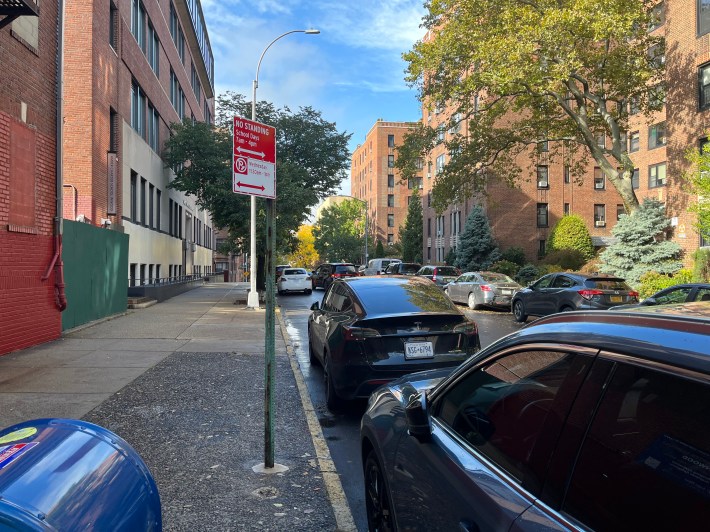 parked vehicles in the loading zone in front of the Amber Charter School on West 215th Street in Inwood. Photo: Eve Kessler