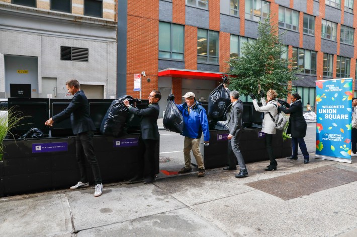 Officials from the Union Square Partnership and New York University inaugurated a "Clean Curbs" trash enclosure on 15th Street on Friday. Photo: NYU