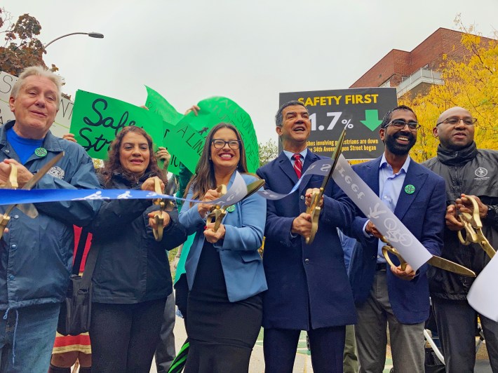 Ydanis Rodriguez any Jackson Heights pols cut a ceremonial ribbon on Paseo Park on Monday. Photo: Julianne Cuba