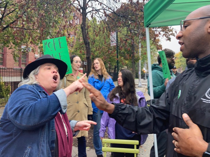 A woman screams at Queens Borough President Donovan Richards. Photo: Julianne Cuba