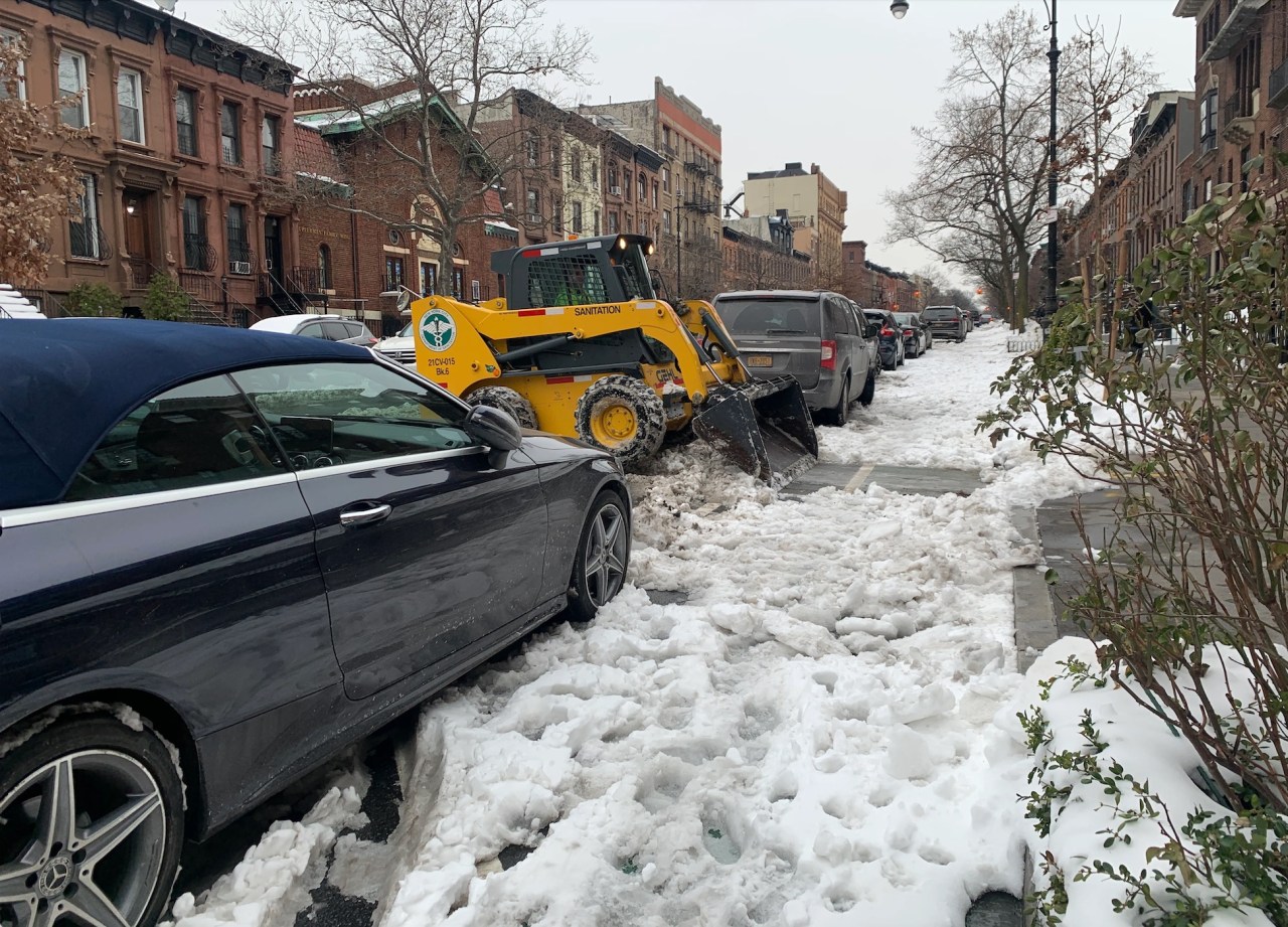 A skid steer removes snow from the Ninth Street bike lane in Park Slope in 2020. File photo: Gersh Kuntzman