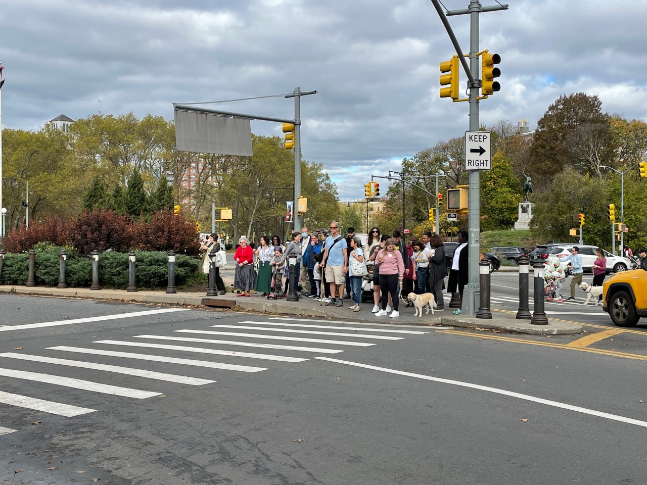 A group of pedestrians stuck on an island trying to cross Flatbush Avenue and Plaza Street at Grand Army Plaza. Photo: Dave Colon