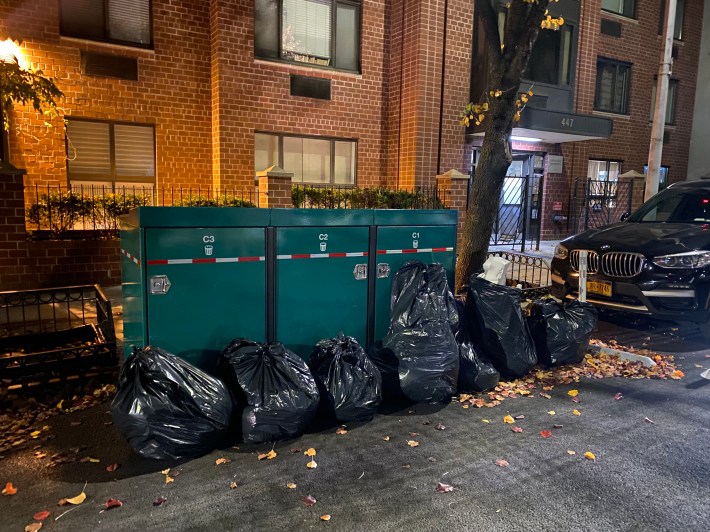 Supers for one group of buildings apparently didn't get the memo that they could start using the bins on Dec. 13. Photo: Kevin Duggan