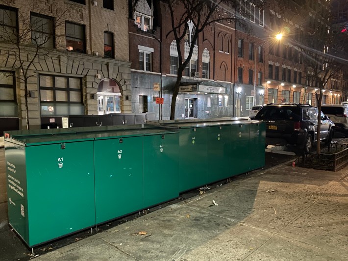 Containing multitudes: The trash boxes keep the sidewalks free of garbage backs. Photo: Kevin Duggan