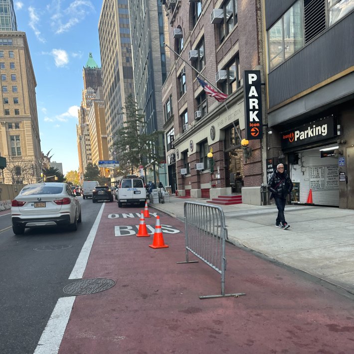 Desperate measures: A business on Livingston Street had to set up cones and a fence to keep their loading dock clear of illegal parking. Photo: @NYCBikeLanes via Twitter