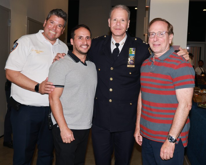 The NYPD's Brooklyn South patrol unit tweeted out this picture of (from left) Lt. Ira Jablonsky, Sholem Klein, Assistant Chief Michael Kemper and an unidentified man last year. Photo: NYPD