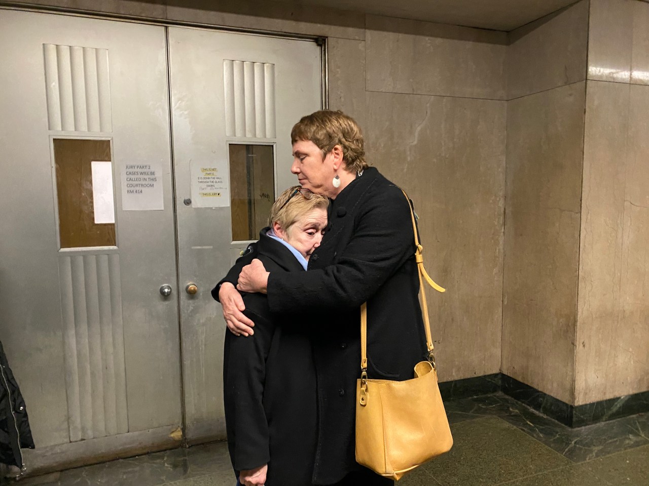Christopher Brimer (left) is embraced by a friend outside the courtroom after the sentencing at Manhattan Criminal Court on March 7. Photo: Kevin Duggan