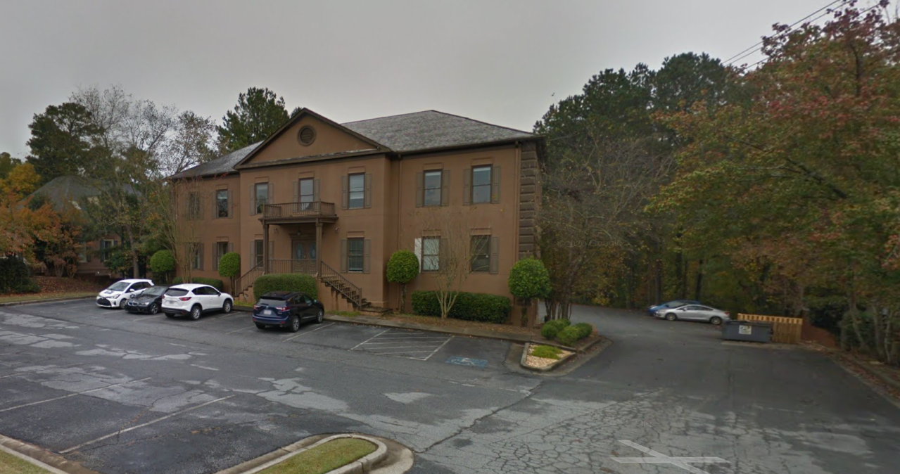 On Google Maps, this building is identified as a home building company, not a car dealership.