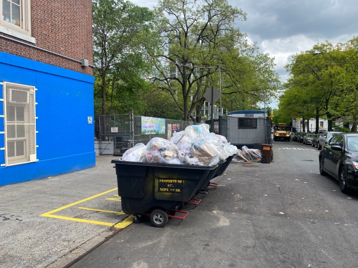 The schools on W. 123rd Street already stage their trash in the curb. Photo: Kevin Duggan
