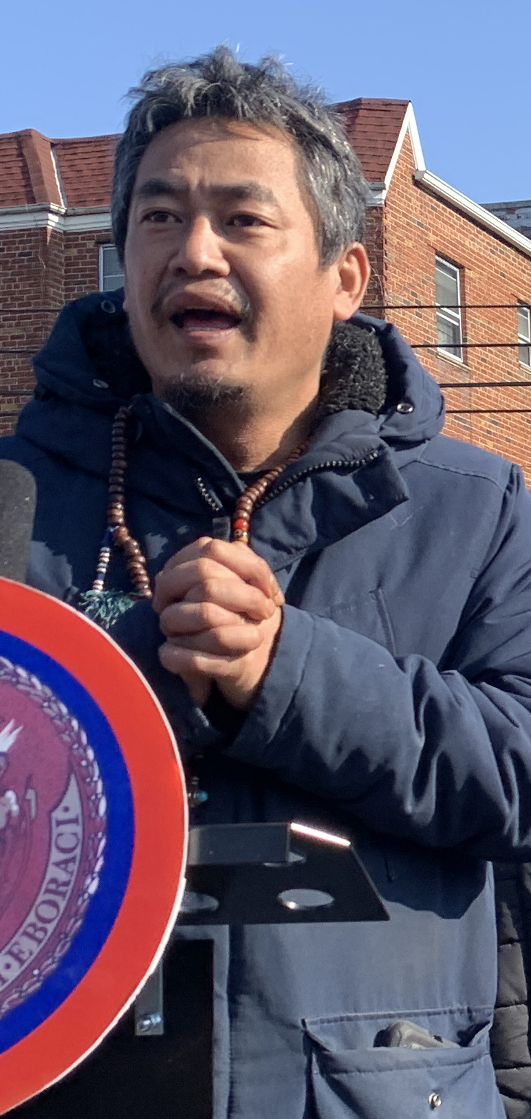 Grieving dad Tsering Wangdu at a recent rally.