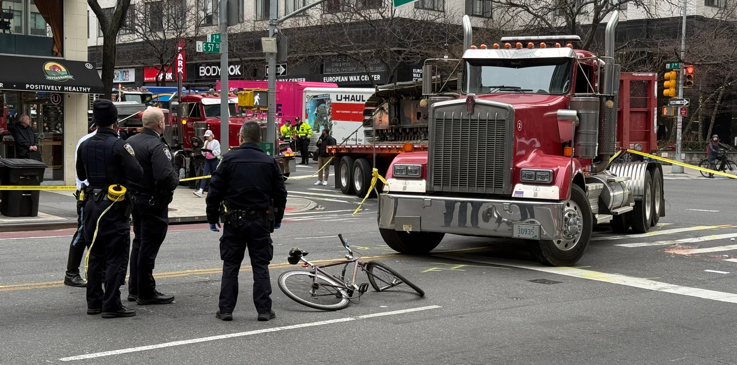 Photo of truck that injured cyclist is parked next to mangled bicycle of victim