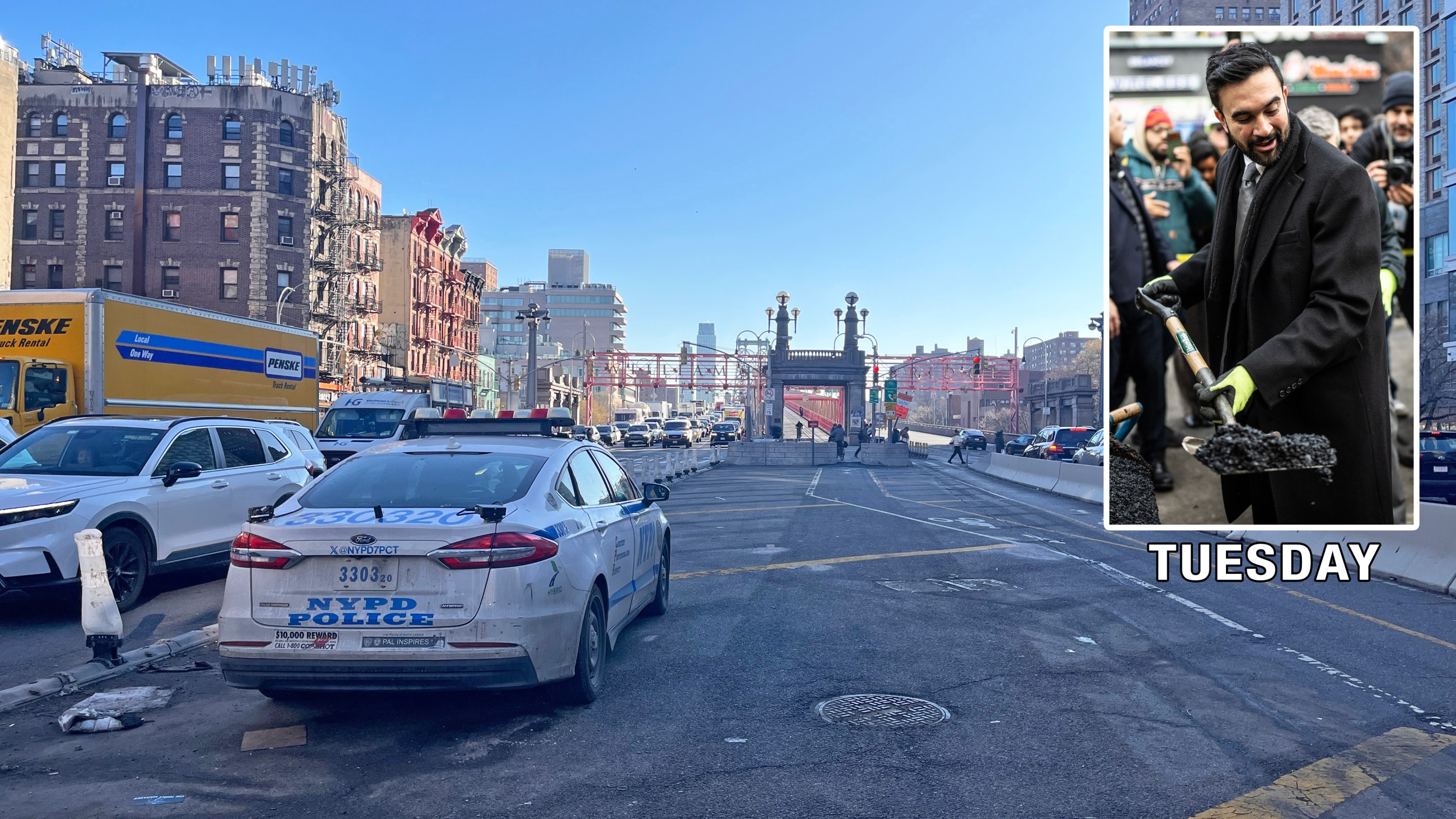 NYPD cruisers stake out bicyclists at the foot of the Williamsburg Bridge in Manhattan