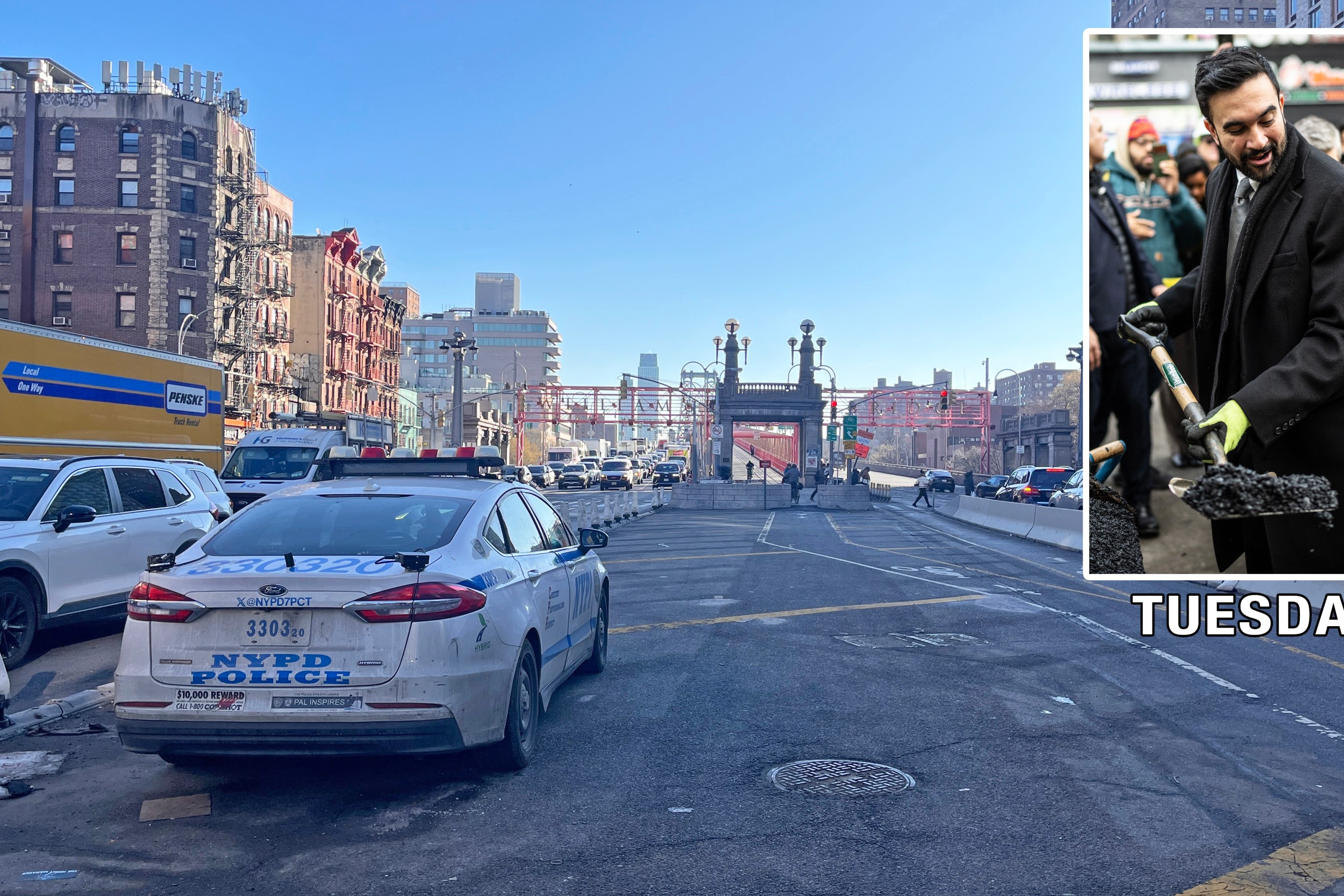 NYPD cruisers stake out bicyclists at the foot of the Williamsburg Bridge in Manhattan
