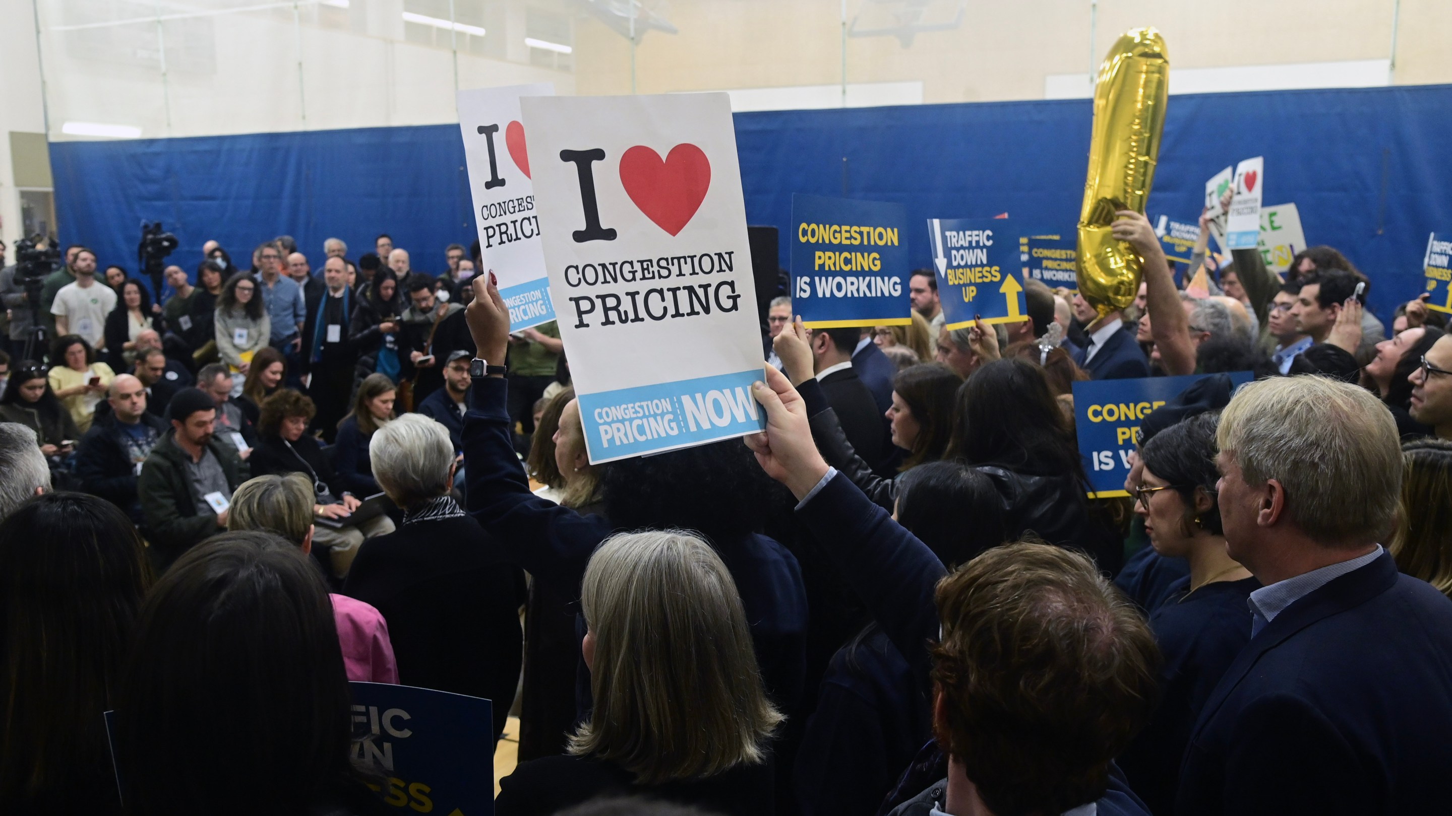 People rally in support of congestion pricing