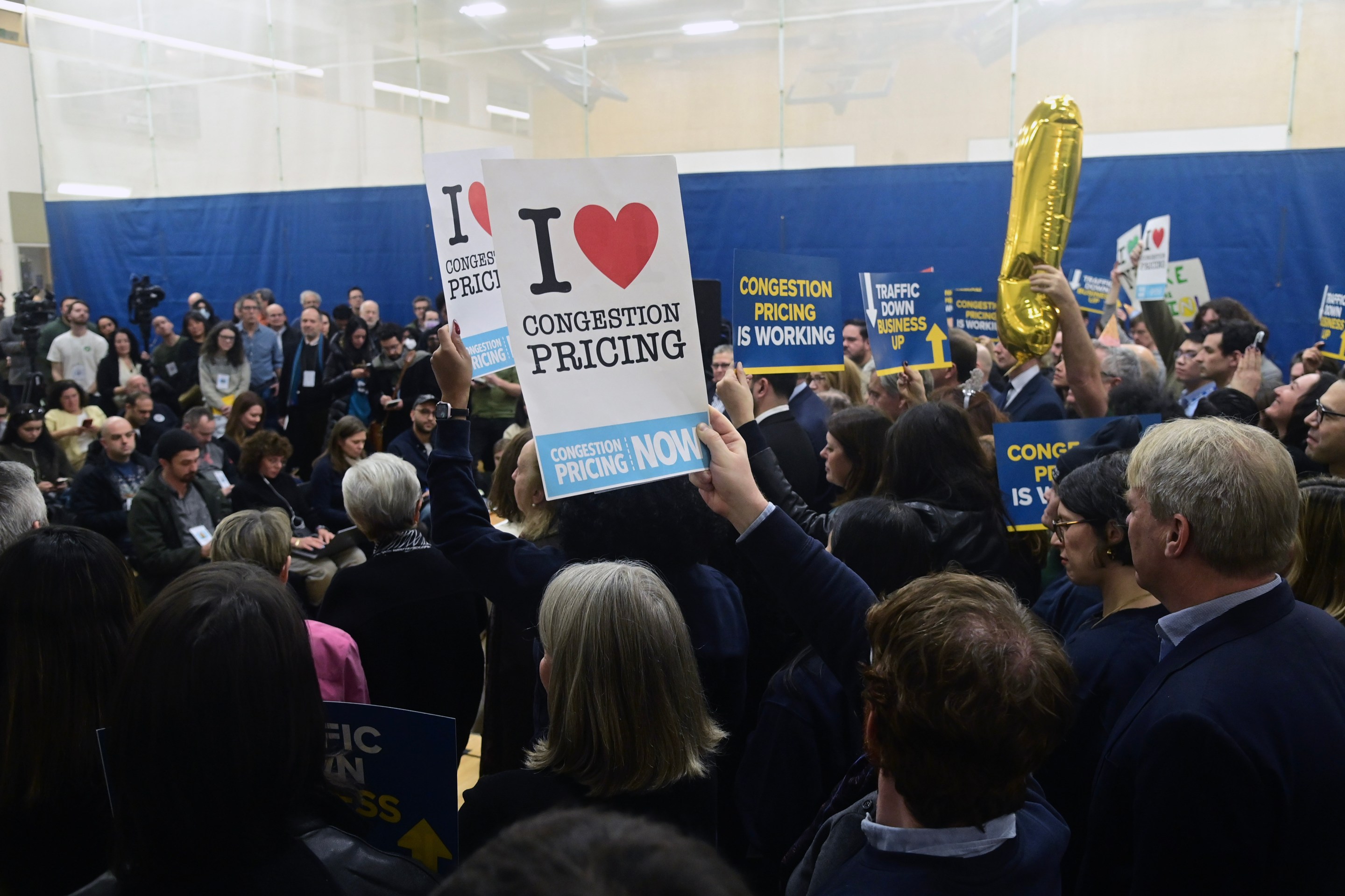 People rally in support of congestion pricing