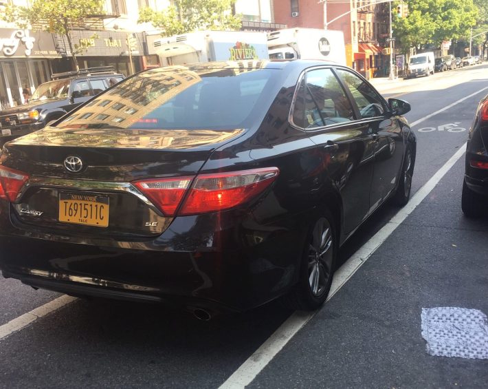This Uber driver — yes, in the bike lane — has racked up 30 tickets in three years, including multiple moving violations. Photo: Vivian Lipson